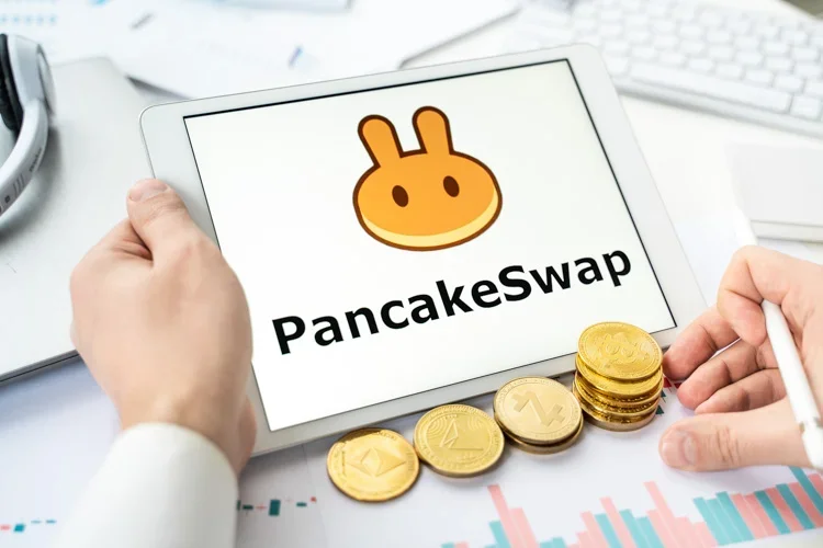 Биржа PancakeSwap открыта на экране планшета с криптовалютами.